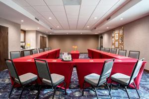 a conference room with a red table and chairs at Hampton Inn & Suites Indio, Ca in Indio