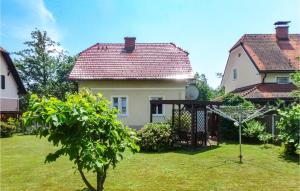 a white house with a red roof and a yard at 4 Bedroom Beautiful Home In Deutschlandsberg in Deutschlandsberg