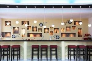 The lounge or bar area at Rhodian Sun Hotel
