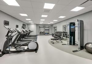 a gym with a row of treadmills and machines at Hampton Inn by Hilton Irvine Spectrum Lake Forest in Lake Forest