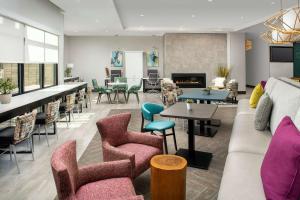 a living room with a couch and chairs at Home2 Suites By Hilton Denver Northfield in Denver