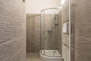 a bathroom with a shower and a toilet in it at XXXl bed/ free parking/ central in Vienna +15 photos