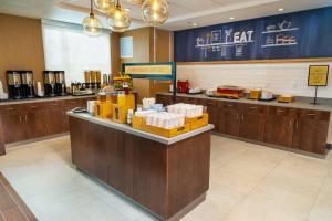 a restaurant with a counter with boxes on it at Hampton Inn & Suites Imperial Beach San Diego, Ca in Imperial Beach