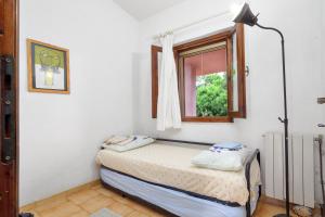 Postel nebo postele na pokoji v ubytování Villetta Meyer Lu Pitrali