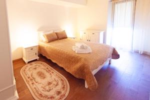 a bedroom with a bed with a towel on it at Aparthotel Mirage Sunset - zona Hotel Rex in Mamaia