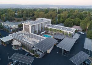 an overhead view of a building with solar panels on it at Doubletree By Hilton Chico, Ca in Chico