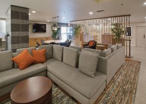 a living room with a couch and a table at Doubletree By Hilton Chico, Ca in Chico