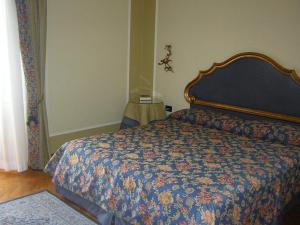 Postel nebo postele na pokoji v ubytování Park Hotel Villa Potenziani