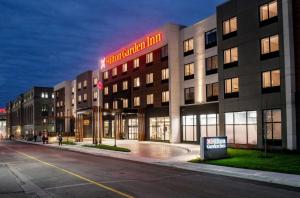 a building with a sign that reads hotel imperial inn at Hilton Garden Inn Moncton Downtown, Nb in Moncton