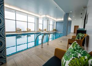 a large swimming pool in a hotel room at Hilton Garden Inn Moncton Downtown, Nb in Moncton