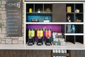 a store display with a row of wine bottles on a counter at Home2 Suites By Hilton Melbourne Viera in Melbourne