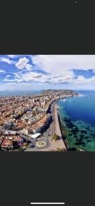an aerial view of a city next to the ocean at Casa Glicine in Milazzo