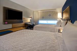 Postel nebo postele na pokoji v ubytování Tru By Hilton Rockwall Dallas, Tx
