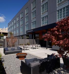 a building with couches and tables in front of it at The Haywood, Tapestry Collection by Hilton in El Dorado