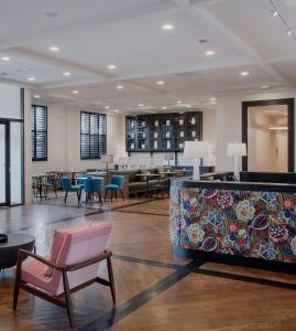 a lobby with a waiting area with chairs and tables at The Haywood, Tapestry Collection by Hilton in El Dorado