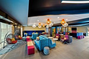 a lobby with blue furniture and colorful chairs at Tru By Hilton Franklin Cool Springs Nashville, Tn in Franklin