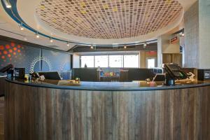 a lobby with a bar in a hospital at Tru By Hilton Monroe, Oh in Monroe