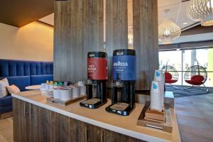a hotel room with two coffee machines on a counter at Tru By Hilton Monroe, Oh in Monroe +33 photos