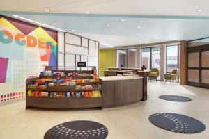 a lobby of a store with a cash register and a counter at Home2 Suites By Hilton Ogden in Ogden