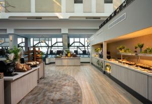 a view of the lobby of a restaurant at Leonardo Royal Hotel Brighton Waterfront in Brighton & Hove