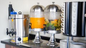 a couple of juicing equipment sitting on top of a counter at Bellezza Hotel in Istanbul