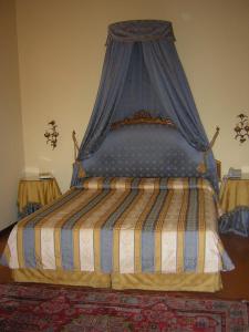 Postel nebo postele na pokoji v ubytování Park Hotel Villa Potenziani