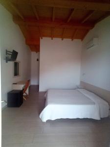 Postel nebo postele na pokoji v ubytování B&B da AnnaMaria