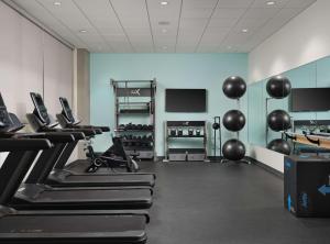 a gym with treadmills and cardio equipment in a room at Tru By Hilton Indianapolis Downtown, In in Indianapolis