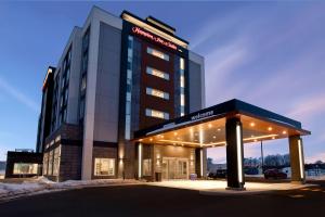 a building with a sign on the front of it at Hampton Inn & Suites Ottawa West, Ontario, Canada in Ottawa