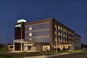a large building with a sign on top of it at Home2 Suites By Hilton Martinsburg, Wv in Martinsburg