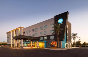 a hotel with a sign on the front of it at Tru By Hilton Phoenix Glendale Westgate in Glendale