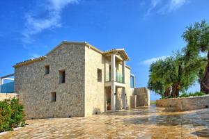 an image of a stone house at Villa Acropolitana by PosarelliVillas in Acharavi
