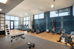 a gym with a bunch of exercise equipment in it at Valley Hotel Homewood Birmingham - Curio Collection By Hilton in Birmingham