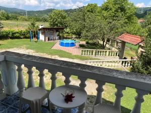a view from the balcony of a house with a pool at Vacation Home Yoanna in Tryavna