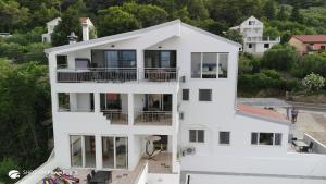 an aerial view of a white house at Villa Ana in Preko