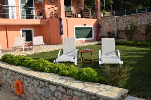 A garden outside Villa Thetis with private pool where the sunsets fade away