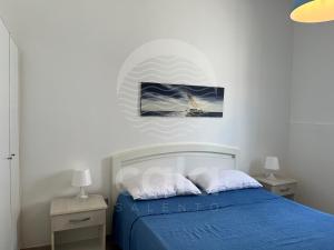Кровать или кровати в номере Villa Aurora By Cala Salento