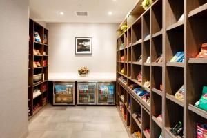 a walk in closet with lots of shelves at Hampton Inn Riverside March Air Force Base, Ca in Riverside