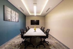 a conference room with a long table and chairs at Hampton Inn Riverside March Air Force Base, Ca in Riverside