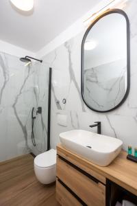 a bathroom with a sink and a mirror at Miranda's Place in Split