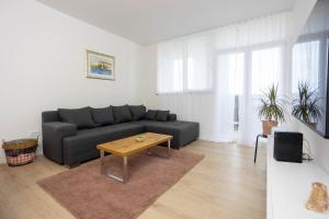 a living room with a couch and a table at Miranda's Place in Split