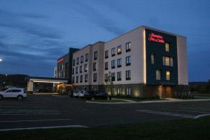 a large building with a sign on the side of it at Hampton Inn & Suites Olean, Ny in Olean