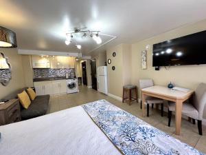 a living room with a large bed and a kitchen at KING BED, Spacious, Legal, VIEW in Honolulu