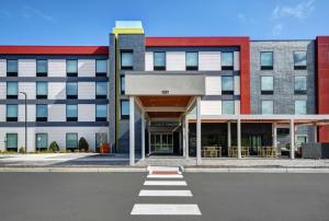 an empty parking lot in front of a building at Home2 Suites by Hilton Blacksburg University in Blacksburg