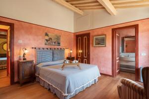 a bedroom with a bed and a table in it at Villa Monte Bottigli in Diaccialone +51 photos