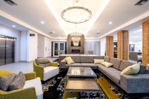 a living room with a couch and a table at Doubletree Sulphur Lake Charles in Sulphur