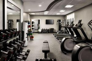 a gym with lots of treadmills and machines at Home2 Suites By Hilton Bend, Or in Bend