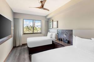 Postel nebo postele na pokoji v ubytování Hilton Grand Vacations Club Maui Bay Villas