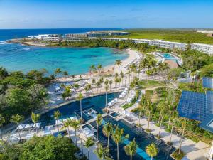 an aerial view of a resort with a pool and a beach at Conrad Tulum Riviera Maya in Tulum
