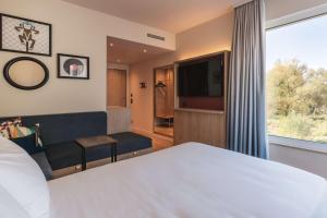 Hampton by Hilton Konstanz客房内的一张或多张床位